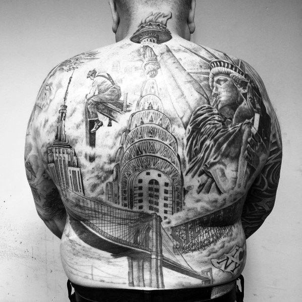 Full-back black-and-grey tattoo featuring the Chrysler Building, Brooklyn Bridge, Statue of Liberty, and Empire State Building in a NYC tribute.