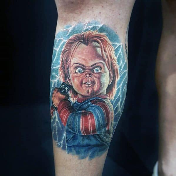 Realistic Chucky tattoo with glowing blue eyes, intense expression, and lightning effects, creating a bold and electrifying horror design.