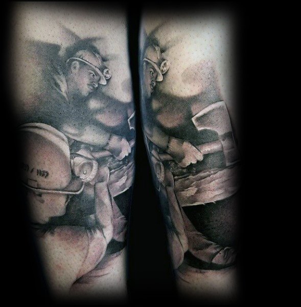 Black and grey tattoo of two coal miners working underground with helmets and tools, shaded for depth and realism.