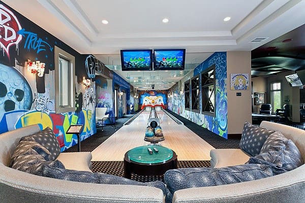incredible cool basement bowling alley curved sofa 