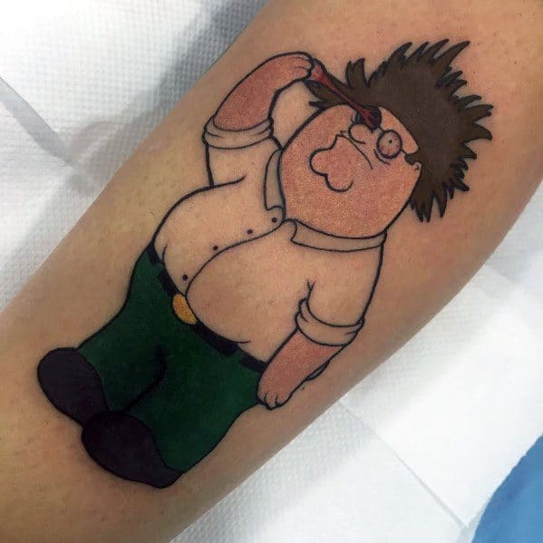 Tattoo of Peter Griffin from Family Guy with wild hair and an arrow through his head, referencing a classic slapstick injury moment from the show.