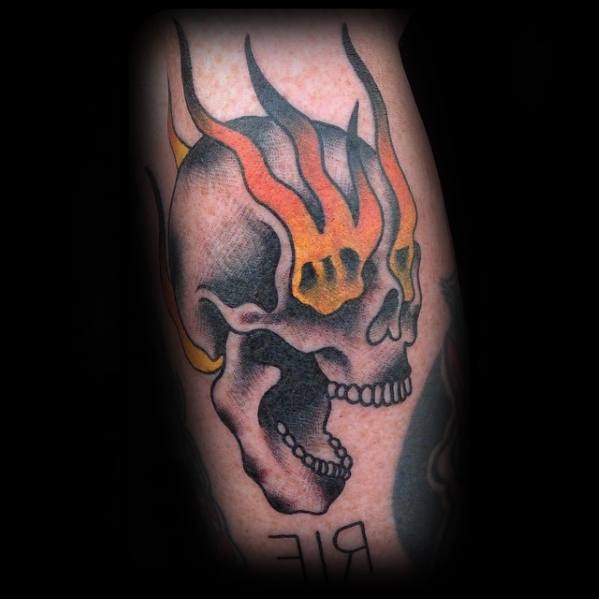 Incredible Flaming Skull Eyes Tattoos For Men On Leg