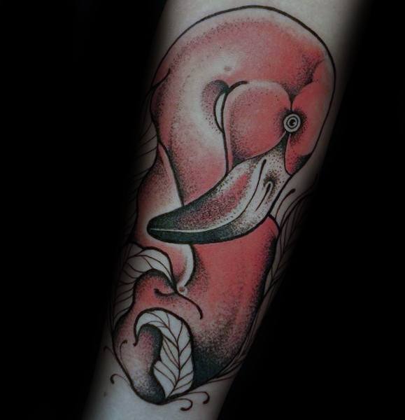 Dotwork flamingo tattoo with bold shading, soft gradients, and intricate leaf details, creating a textured and artistic design.