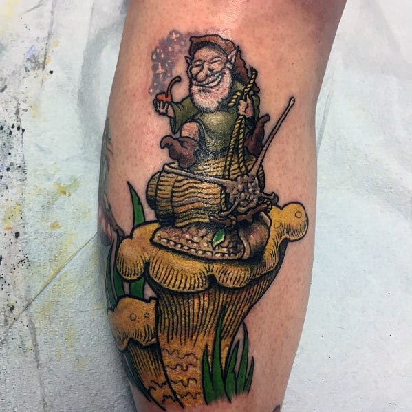 Tattoo of a joyful gnome sitting in a woven basket on top of a large mushroom, holding a staff and casting sparkles with a magical aura.