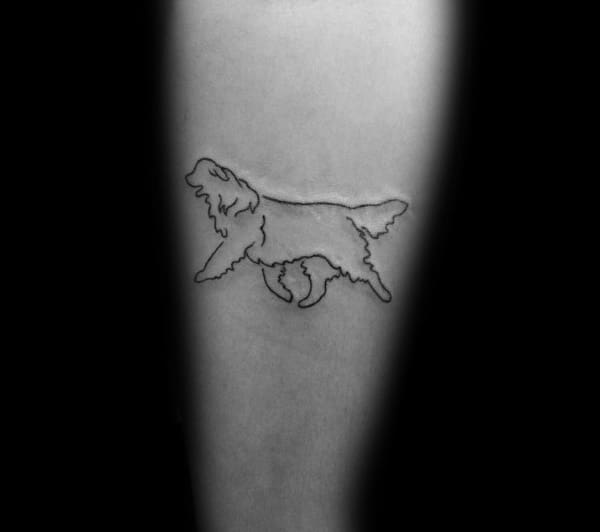 Minimalist Golden Retriever outline tattoo on the forearm, featuring a simple, fine-line design of the dog in a walking pose for a subtle look.