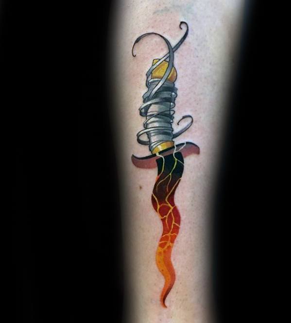 Tattoo of a dagger wrapped in grey ribbon with a curved blade fading from black to fiery red, orange, and yellow with crackle texture.