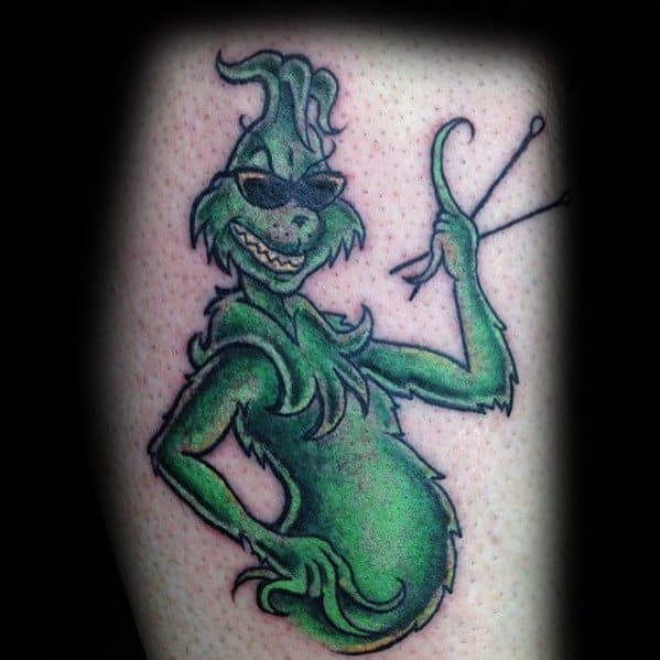 Grinch wearing sunglasses and striking a cool pose, with vibrant green shading and bold lines, creating a fun and confident tattoo design.