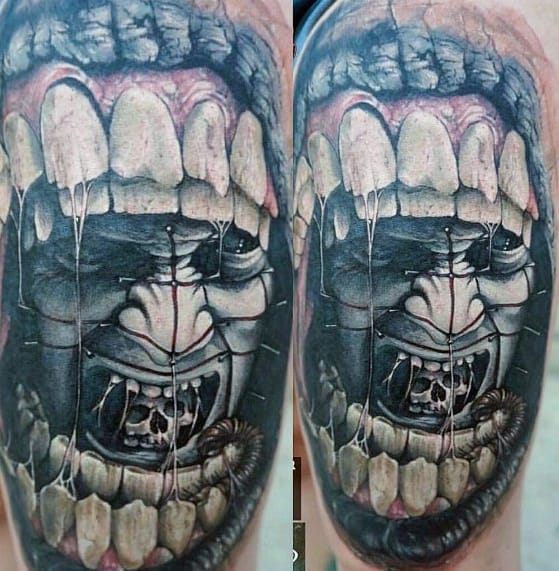 Hyper-realistic *Hellraiser* tattoo of a screaming face trapped within a grotesque, tooth-filled frame, featuring intense shading and eerie details.