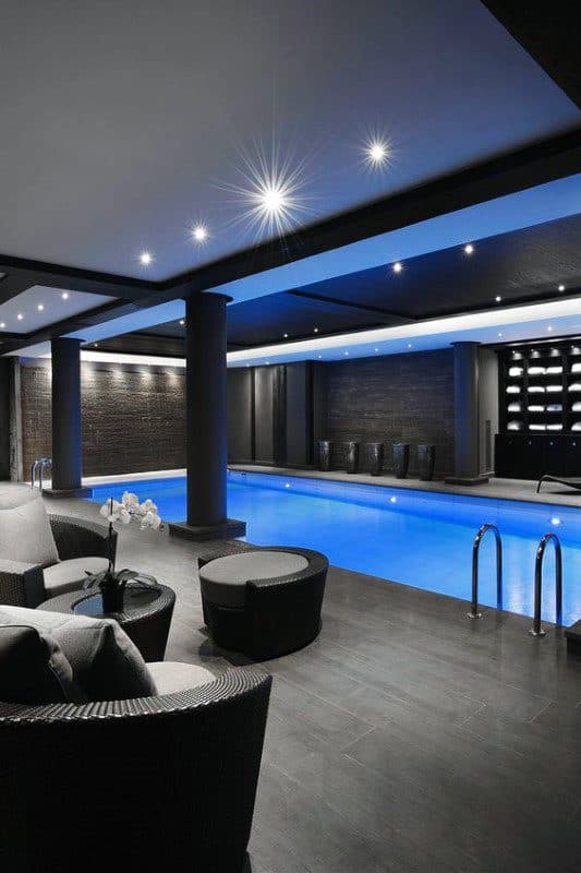 basement indoor swimming pool wicker furniture 