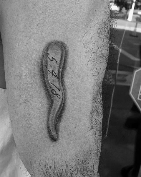 Minimalist Italian horn tattoo with a significant date inscribed, symbolizing luck, protection, and a meaningful memory.