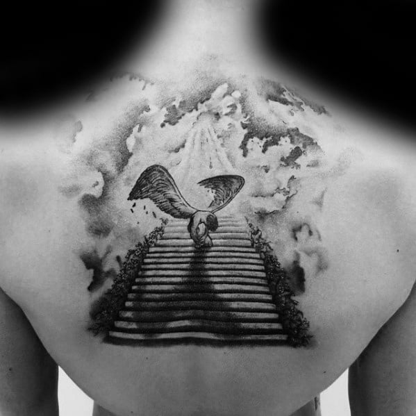 Back tattoo of a winged figure ascending a staircase into the clouds with rays of light above, inspired by Led Zeppelin themes.