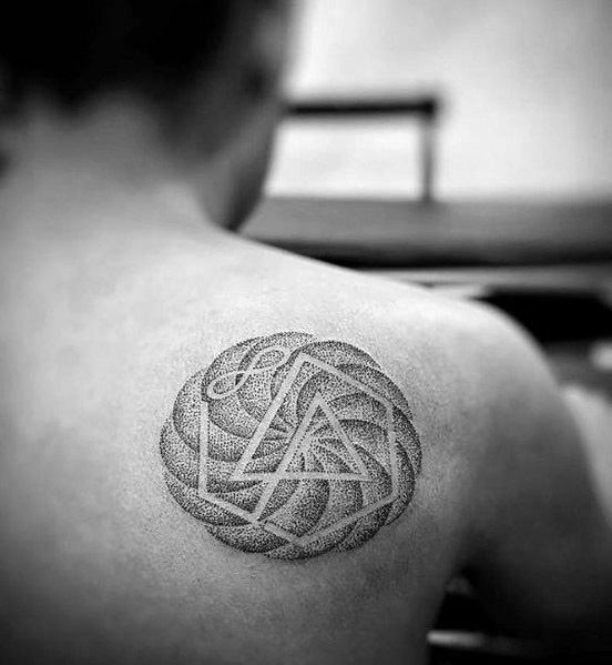 Intricate dotwork tattoo of the Linkin Park logo on the upper back, surrounded by a detailed geometric pattern.