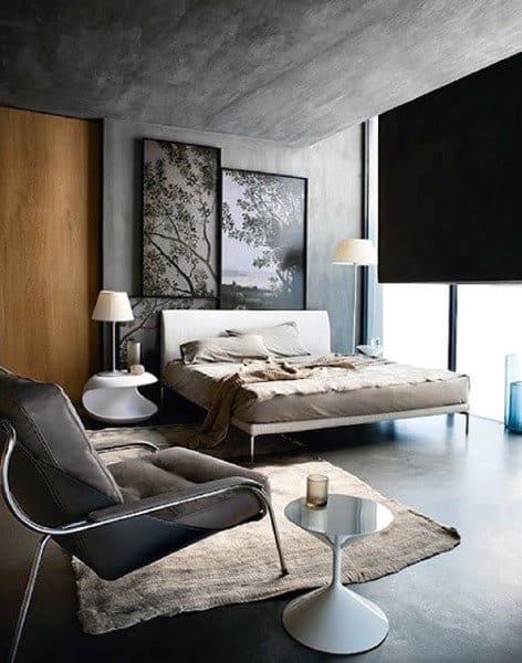 luxury apartment bedroom with gray accent chair 