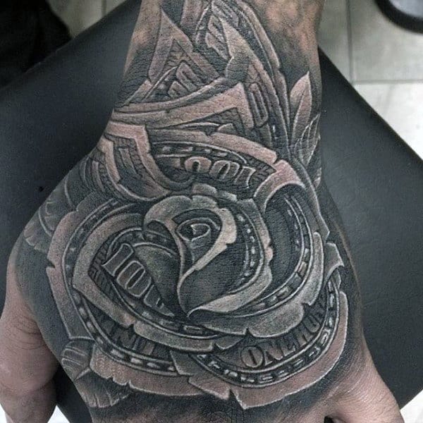 Tattoo of money rolls forming a rose on the back of a hand