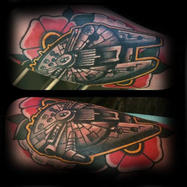 Millennium Falcon tattoo with bold black lines and red flowers, merging Star Wars detail with classic tattoo art flair.