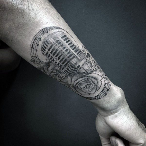 Incredible Musical Notes Tattoo With Microphone And Flowers Guys Forearm