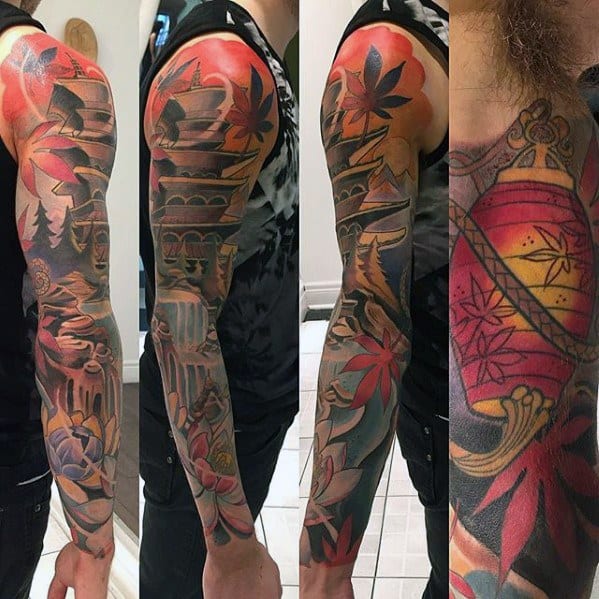 Vibrant full sleeve tattoo featuring a Japanese pagoda, maple leaves, lanterns, and mountains in bold red, orange, and black ink.
