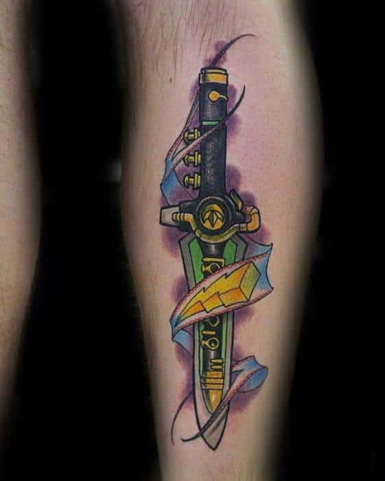 Colorful Dragon Dagger tattoo with lightning bolt detail, surrounded by torn skin effect and purple shading on the leg.