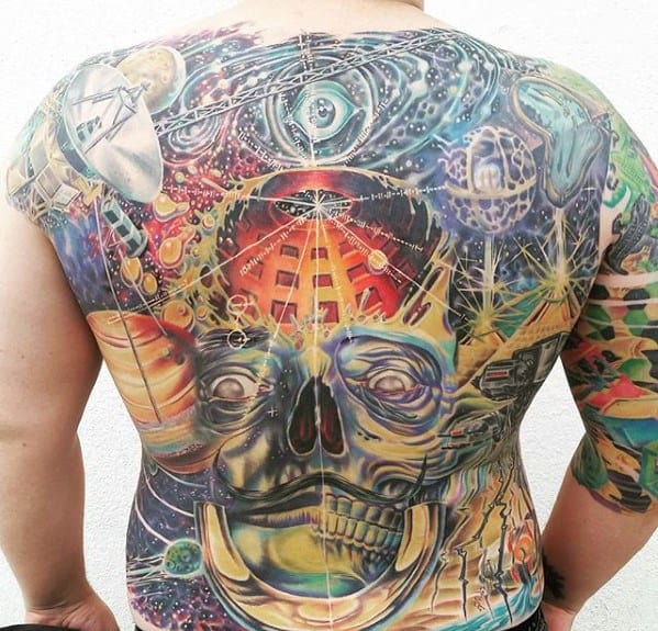 A colorful tattooed back with a cosmic skull, planets, and a spacecraft, accentuated by a pulsar map