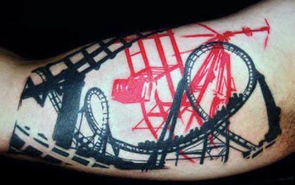 Bold roller coaster tattoo in black and red featuring track loops, cranes, and a helicopter for a dramatic industrial look.