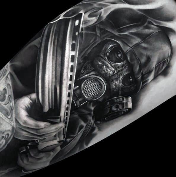 Hyper-realistic black and grey tattoo of a masked figure in a gas mask holding a shotgun, featuring intense shading and dramatic depth.