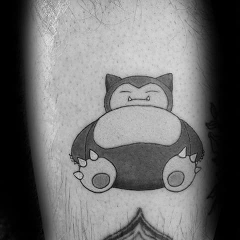 Simple black and grey Snorlax tattoo with clean shading, featuring a calm and seated pose on the leg.