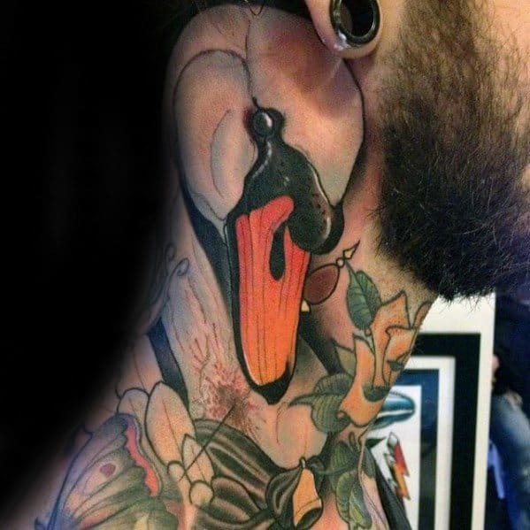 Bold neck tattoo of a stylized swan with a vivid orange beak, surrounded by colorful flowers and traditional-style shading.