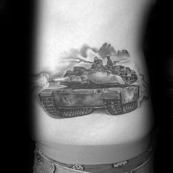 Black and grey side torso tattoo of a tank in action, with two soldiers, mountainous background, and smoke details for added realism.