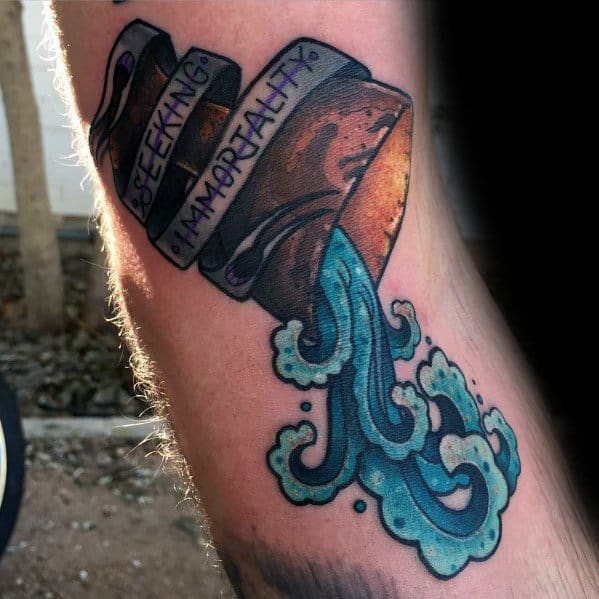 Indiana Jones-inspired tattoo featuring the Holy Grail pouring mystical water, with a banner reading 'Seeking Immortality' in bold lettering.