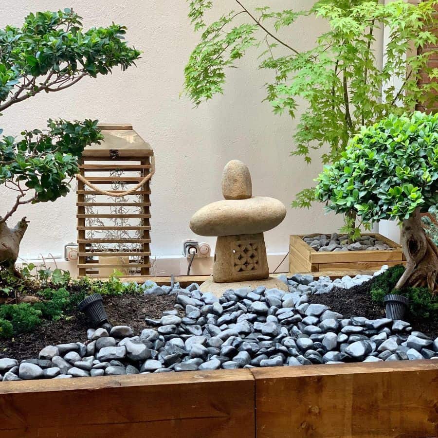 small indoor garden bonsai gray stones statue 