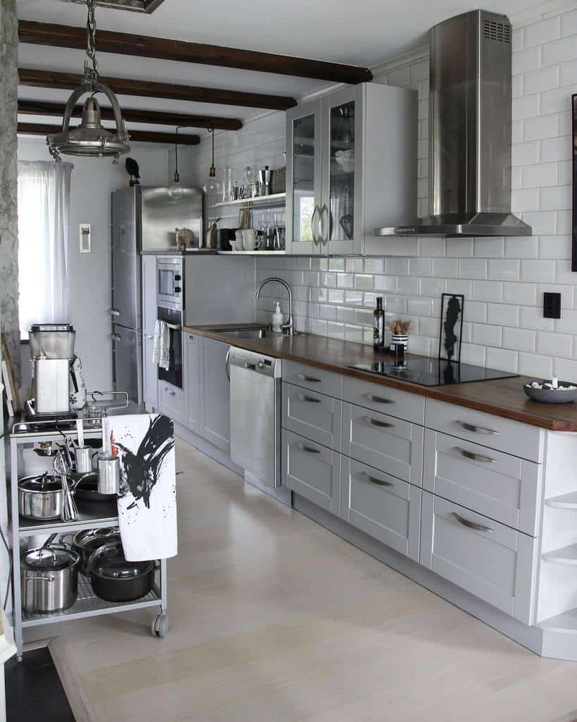 industrial galley kitchen white cabinets white wall tiles trolley with appliances