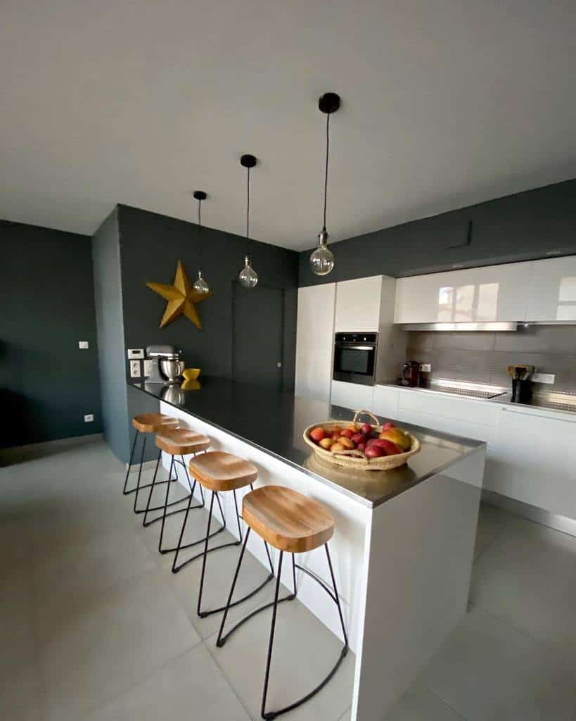 modern industrial galley kitchen white cabinets wood stools pendant lights