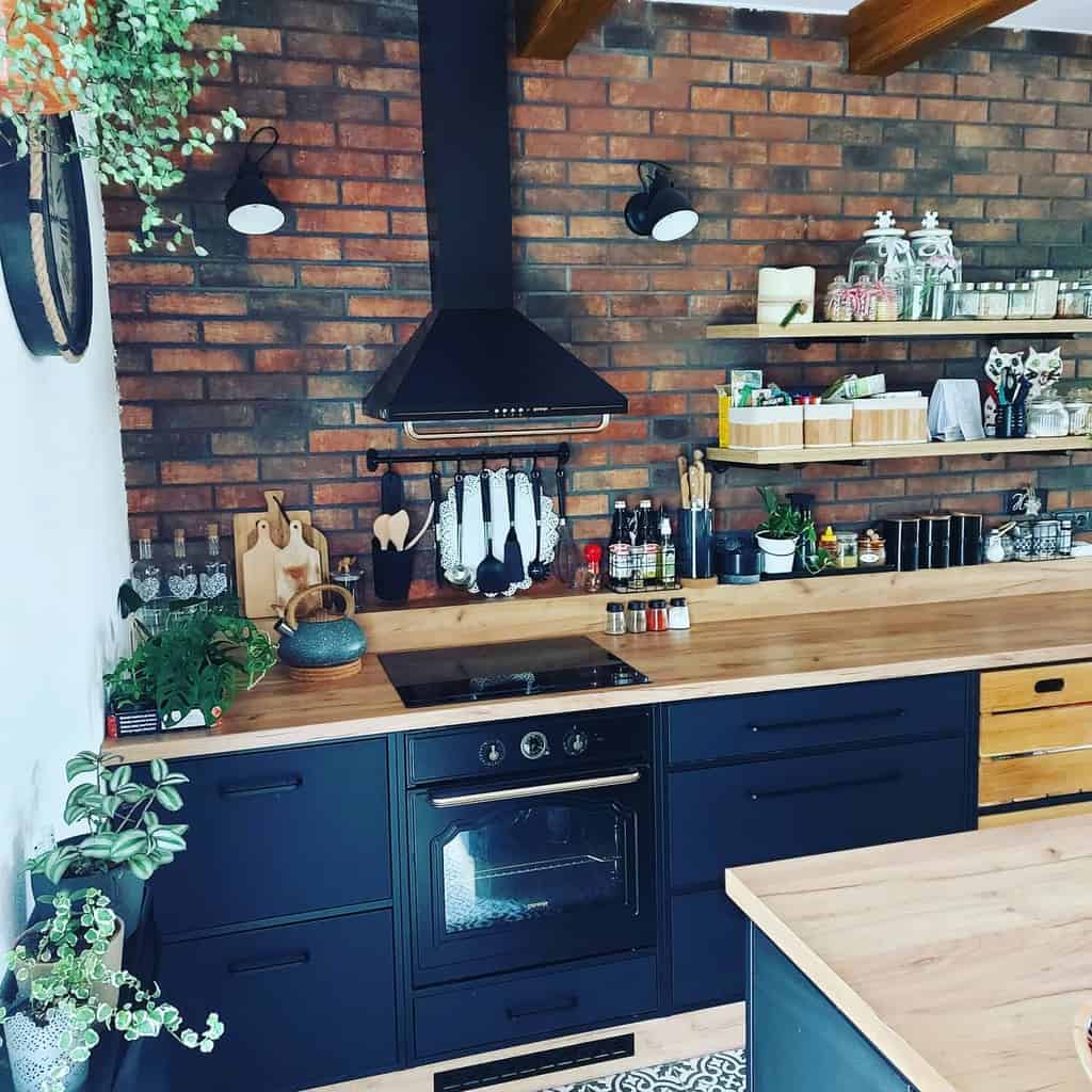 country kitchen blue cabinets wood countertop brick splashback