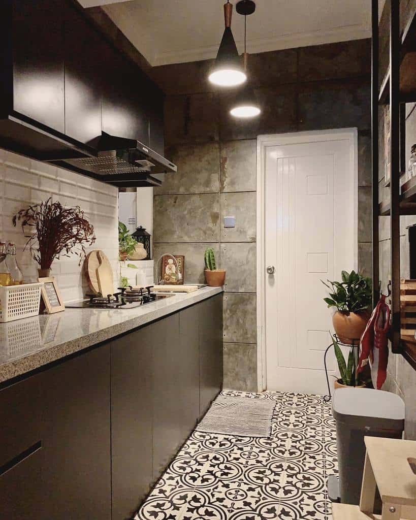 industrial galley kitchen gray slate tile wall black cabinets track lighting