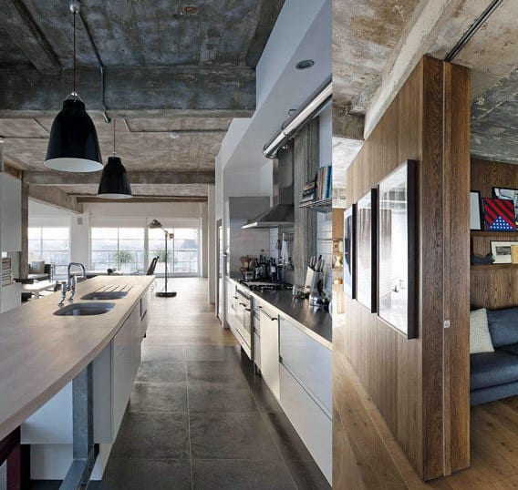 Industrial kitchen with concrete ceiling, wooden countertops, and modern pendant lighting.