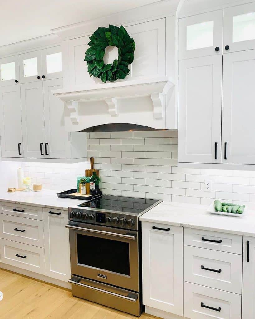 country kitchen subway tile splashback white cabinets black accents
