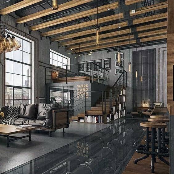 Industrial loft with exposed beams, large windows, mezzanine, and sleek modern furniture.