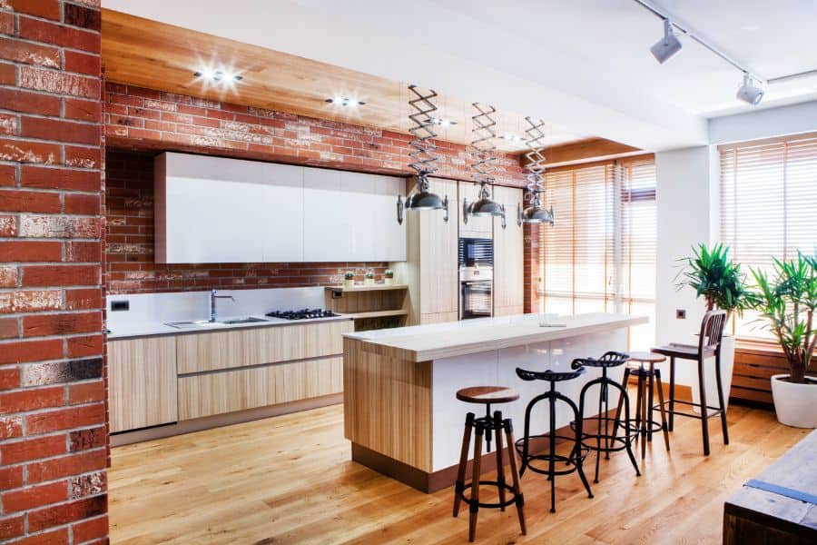 brick accent wall in modern open kitchen
