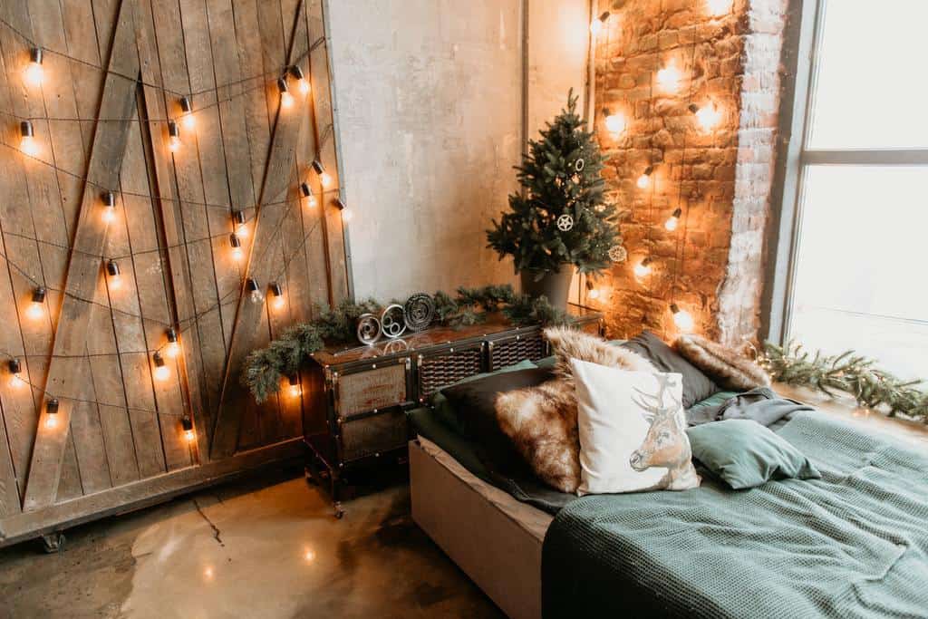 simple rustic bedroom with hanging globe lights