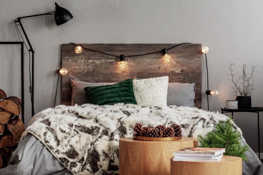 rustic bedroom with wood panel headboard