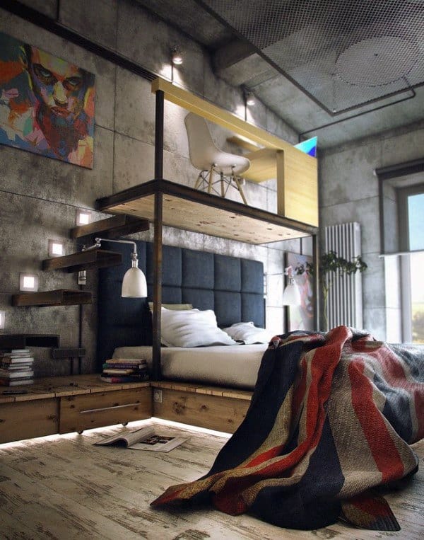 Industrial bedroom with concrete walls, loft workspace, and wooden platform bed.