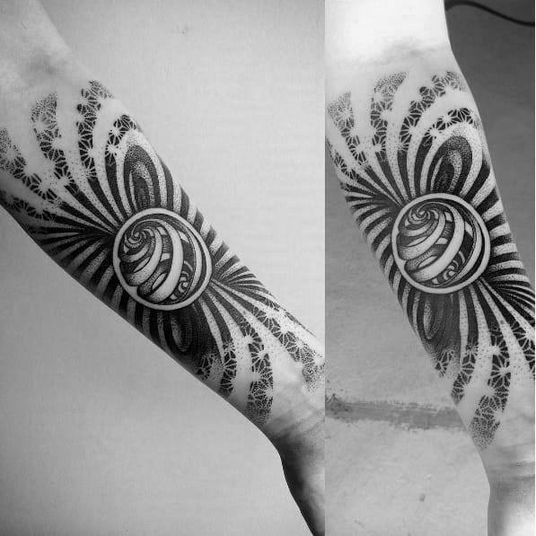 Forearm tattoo inspired by MC Escher, featuring a central twisted sphere with radiating patterns and geometric leaf-like illusions.