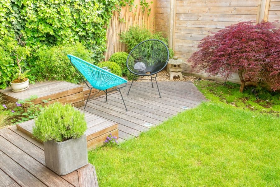 small wood patio with oval chairs