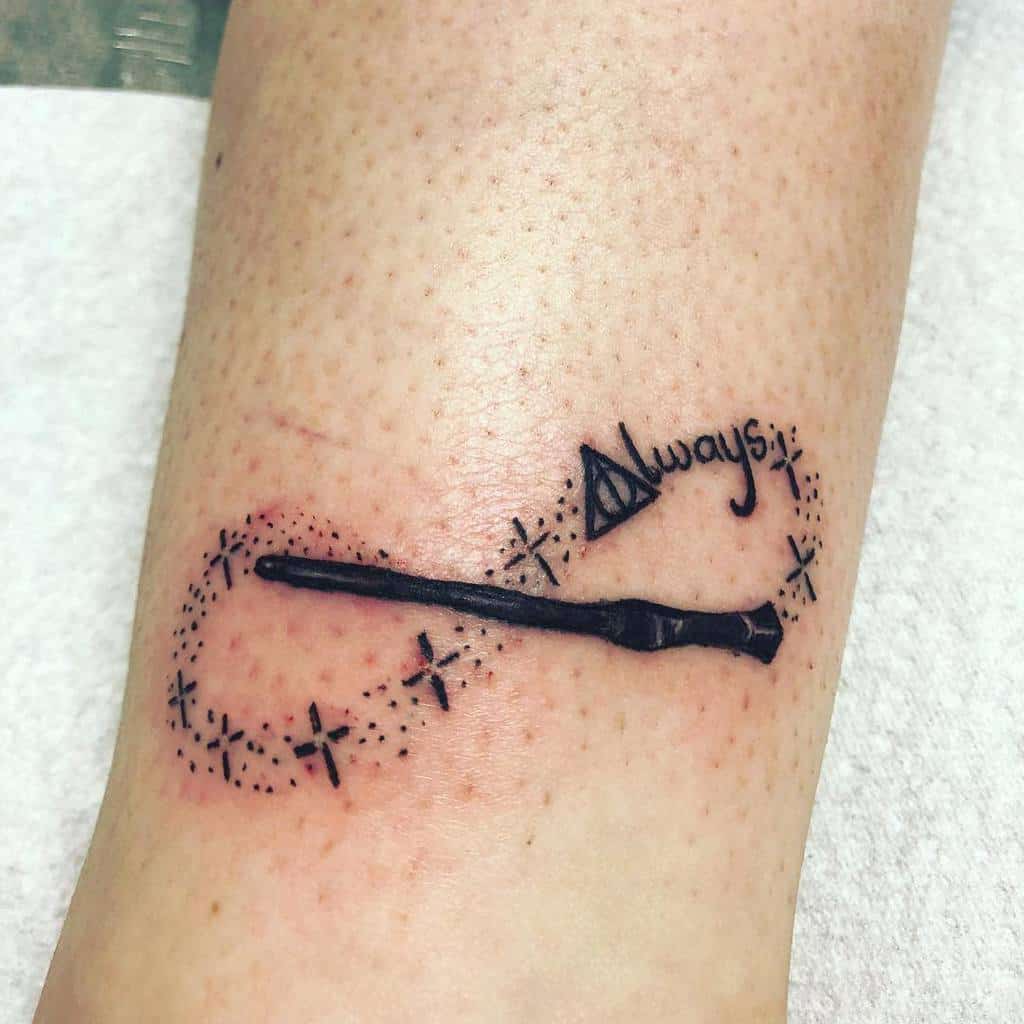Harry Potter-inspired tattoo with an infinity wand design, 'Always,' and the Deathly Hallows symbol, symbolizing eternal magic