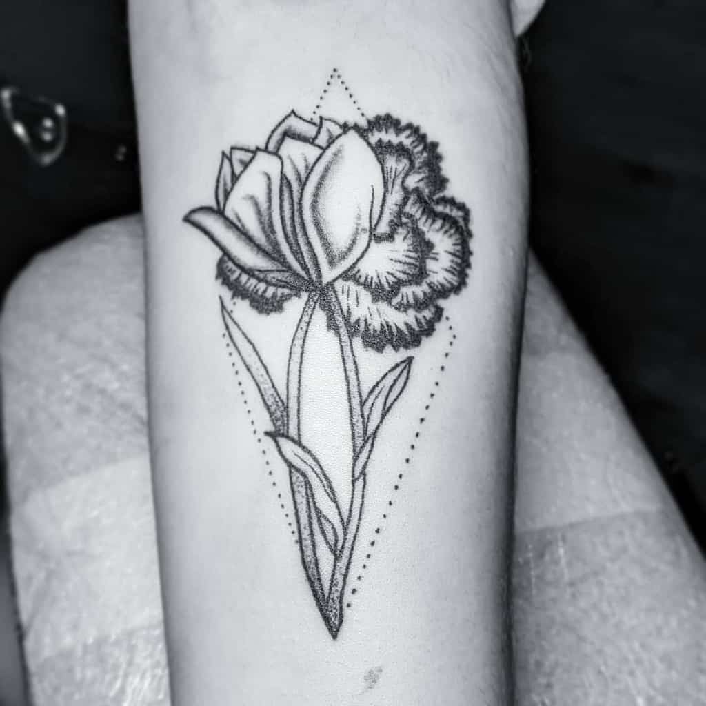 Black and white tattoo of a stylized carnation, with geometric dot patterns surrounding it