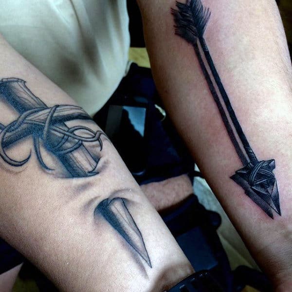 Inky Black Long Arrowhead With Shadow Effect Tattoo On Forearms Men