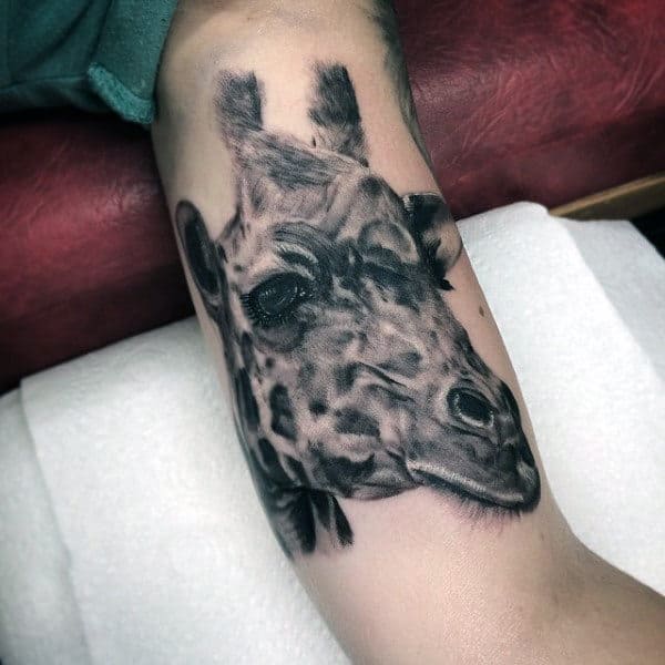 Inner Arm Bicep Giraffe Tattoo On Male