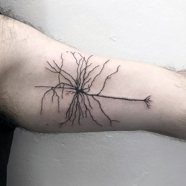 Simple black neuron tattoo on inner bicep with a thin axon and detailed branching dendrites extending outward.