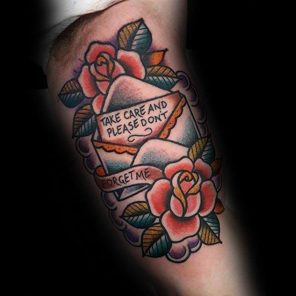 Colorful tattoo of an envelope with the message "Take care and please don't forget me," surrounded by roses and leaves