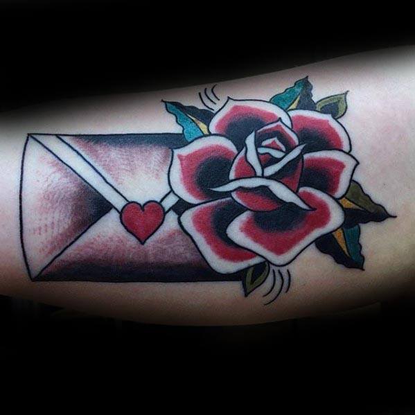 Tattoo of a rose and an envelope sealed with a red heart